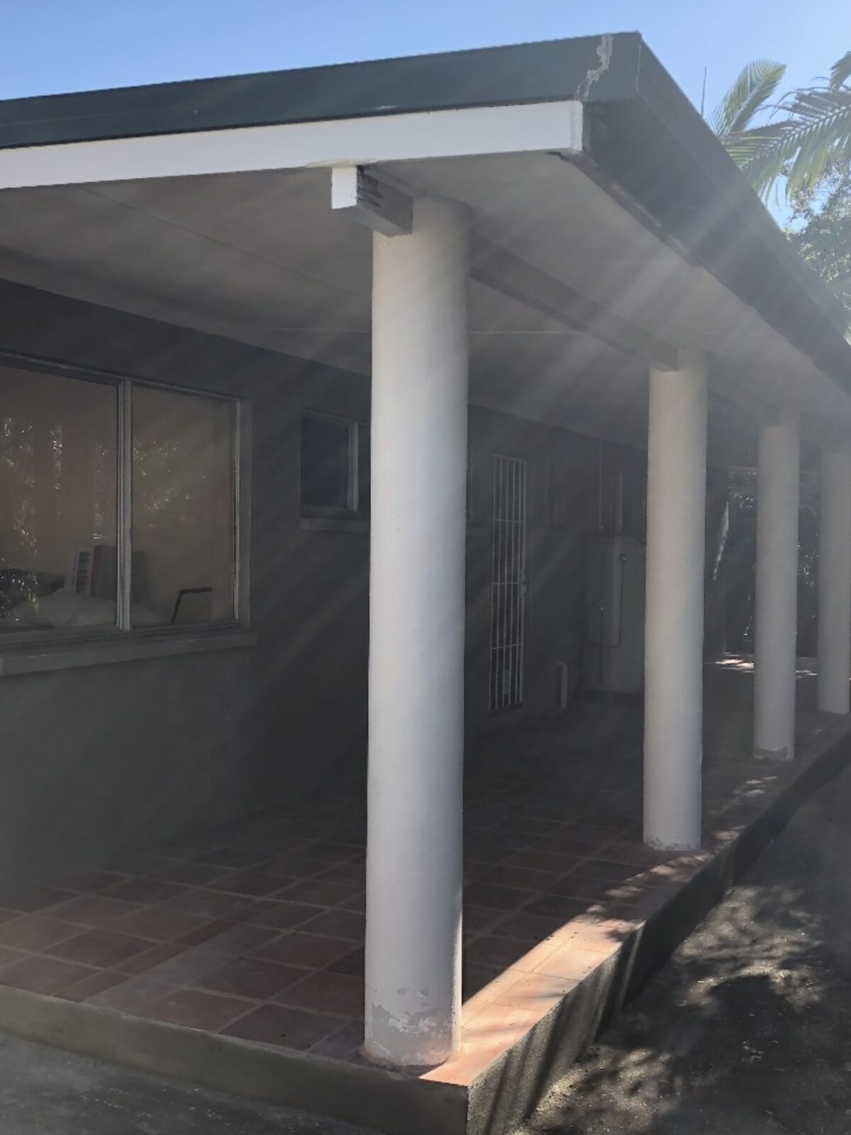 Painted brick home — front elevation — after render